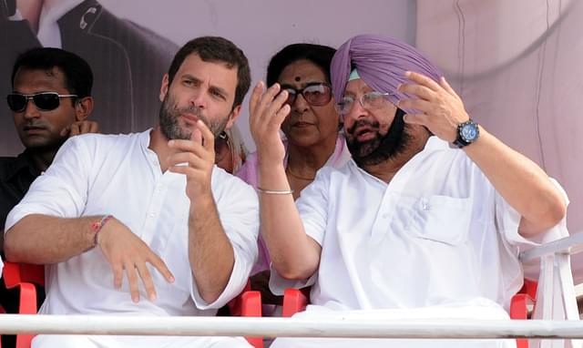 Congress President Rahul Gandhi with Chief Minister of Punjab Capt. Amarinder Singh during a rally. (Bharat Bhushan/Hindustan Times via Getty Images)