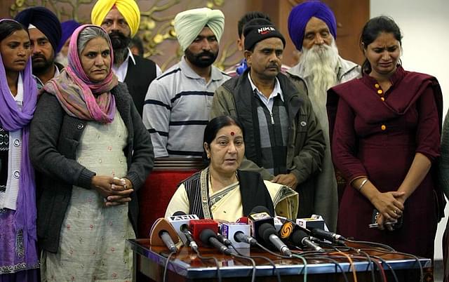 External Affairs Minister Sushma Swaraj with the families of the workers earlier. (Raj K Raj/Hindustan Times via Getty Images)