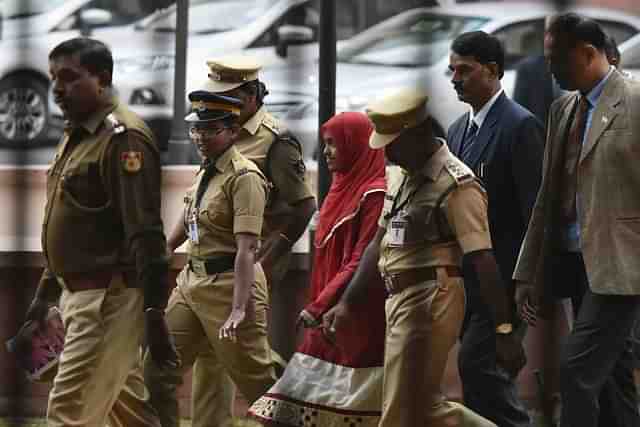 The 24-year-old Hadiya alias Akhila (in red dress) at the Supreme Court after hearing  in New Delhi. (Vipin Kumar/Hindustan Times via Getty Images)