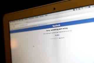 An error message appears on the Facebook home page on a laptop computer screen. (Justin Sullivan/Getty Images)