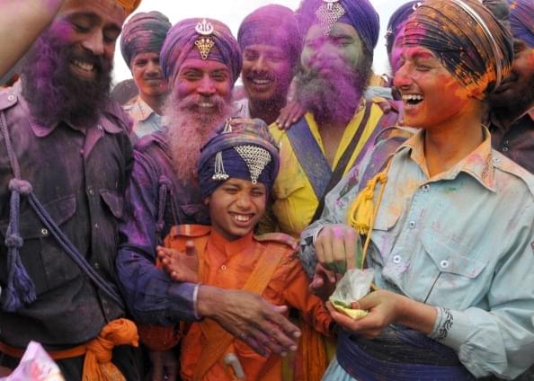 Young Nihangs playing colours during Holla Mohalla celebrations  in Anandpur Sahib. (Sanjeev Sharma/Hindustan Times via Getty Images)