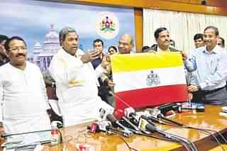 Karnataka Chief Minister Siddaramaiah with the state flag