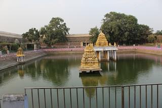 The temple tank (anantasaras) with the sanctum that holds the original wood idol of Varadaraja at the Varadaraja Perumal temple.