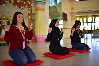 Sara, Basma and Parveen practising  the yogic breathing techniques.