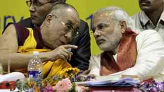 The Dalai Lama, left, speaks with Modi in  2010. (VOA Tibetan)