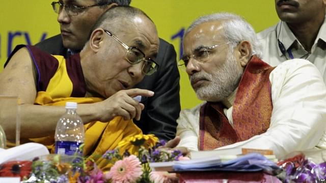 The Dalai Lama, left, speaks with Modi in  2010. &nbsp;