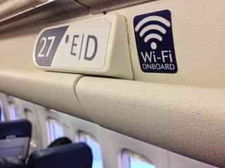 A Wi-Fi on board sign inside a plane (Getty Images)