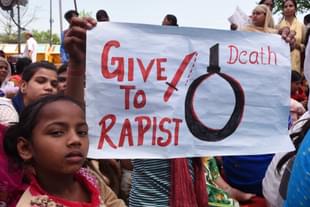 Supporters hold placards during a demonstration in New Delhi (Mohd Zakir/Hindustan Times via Getty Images)