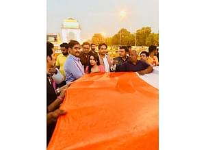 Demonstrators with the giant India flag at the India Gate.
