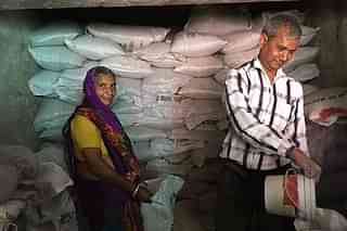 PDS dealer Mansukh Kumar provides ration to a cardholder on Friday