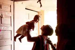 A mother playing with a girl child (Sattish Bate/Hindustan Times via Getty Images)