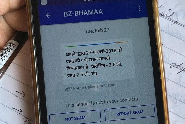 A beneficiary shows a text message&nbsp;