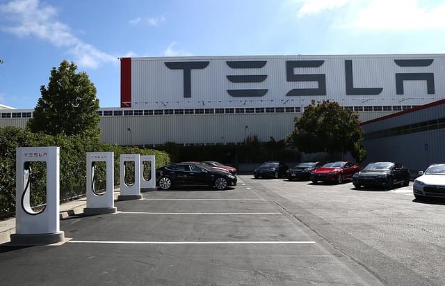 A row of new Tesla Superchargers are seen outside of the Tesla Factory in Fremont, California. (Justin Sullivan/Getty Images)&nbsp;
