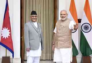 Prime Minister Narendra Modi (R) with Nepal Prime Minister Khadga Prasad Sharma Oli  in New Delhi in 2016. (Sonu Mehta/Hindustan Times via Getty Images)
