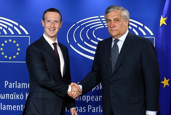 Facebook co-founder, Chairman and CEO Mark Zuckerberg, left, and President of the European Parliament, Antonio Tajani, right, shake hands during their meeting in Brussels, Belgium on 22 May 2018. (Dursun Aydemir/Anadolu Agency/GettyImages)