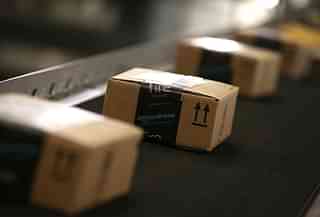 Boxes moving along a conveyor belt at an Amazon fulfillment centre in California (Justin Sullivan/Getty Images)
