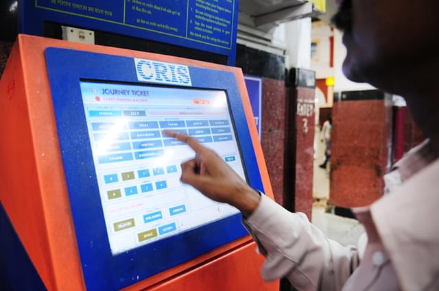 A passenger uses a touch screen Kiosk at Howrah Station to buy a ticket in Howrah. (Indranil Bhoumik/Mint via GettyImages)