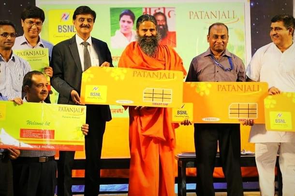 Baba Ramdev launches the Patanjali SIM. (pic via Twitter)