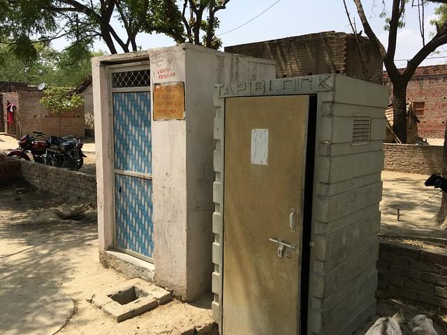 A toilet built under Lohia scheme, left.  A private company installed fibre-sheet toilets that proved useless, right