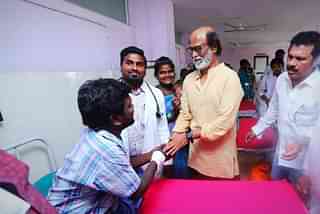 Rajinikanth meeting the people injured during the protests. (pic via Twitter)