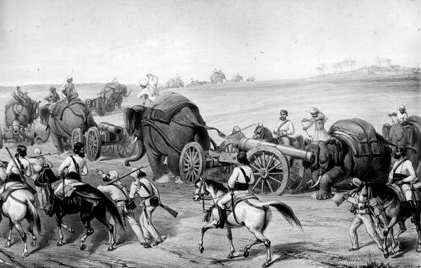 A group of Indian soldiers on their way to Delhi with elephants and cannons during the Indian Mutiny. Original Artwork: Entitled: The Advance Of The Siege Train To Attack Delhi by Captain G E Atkinson, Lithograph by W Simpson. (Hulton Archive/GettyImages)&nbsp;
