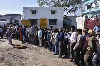Voters line up to cast their votes at a polling station in Ayodhya. (Arun Sharma/Hindustan Times via Getty Images)