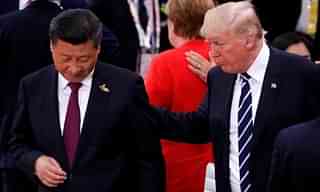 President Trump talks to Xi Jinping during the G20 leaders summit in Hamburg.