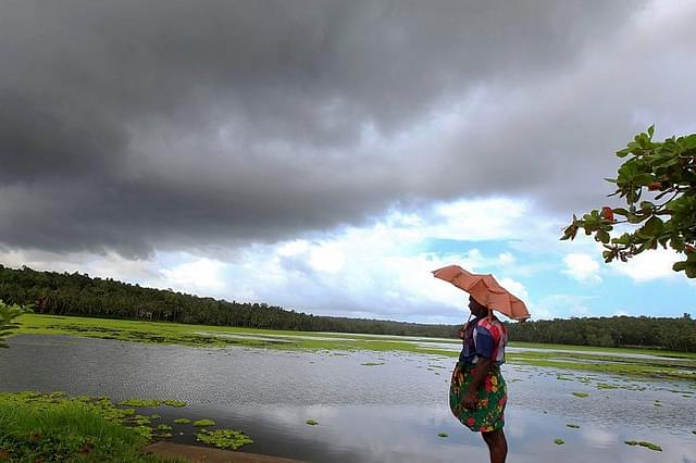 Clouds gathering over a lagoon as the first winds of southwest monsoon hit Kerala. (Vivek R Nair/Hindustan Times via Getty Images)