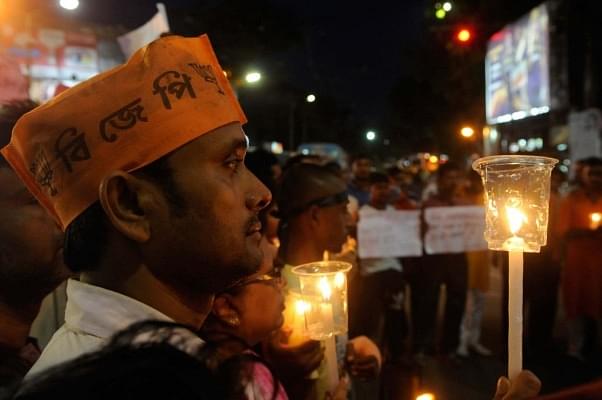 State BJP Yuva Morcha organised a candle march to protest against violence and death of 20 people of different political parties in West Bengal panchayat polls 2018. (Samir Jana/Hindustan Times via Getty Images)