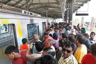 Passengers wait for a metro ride at the Versova Station, Andheri. (Kalpak Pathak/Hindustan Times via GettyImages)