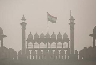 The Indian flag flies on Red Fort amid heavy dust and smog in Delhi. (Allison Joyce/Getty Images)