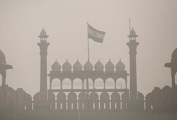 The Indian flag flies on Red Fort amid heavy dust and smog in Delhi. (Allison Joyce/Getty Images)