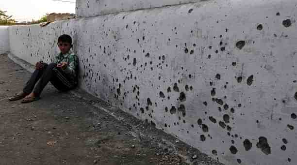 A boy showing splinters of mortar shell fired from the Pakistan side, on 18 January 2018 in he Arnia district of Jammu. (Photo for representation)