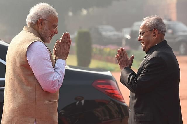 Pranab Mukherjee (R) with PM Narendra Modi. (Virendra Singh Gosain/Hindustan Times via Getty Images)