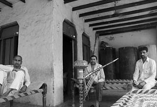 The Bhati brothers at their compound in Tilwada village under the luxury of a fan.  