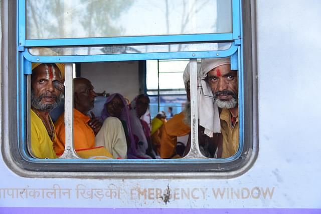 Sadhus on board a Simhastha special train leaving Bhopal to Ujjain to attend Simhastha Mahakumbh at Bhopal railway station  in Bhopal, India. (Mujeeb Faruqui/Hindustan Times via GettyImages)&nbsp;
