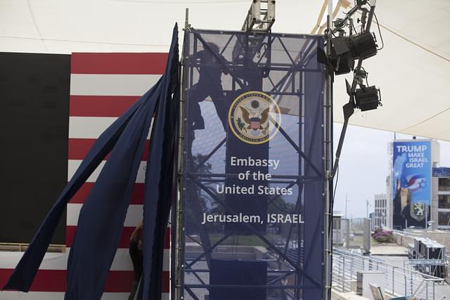 Israeli workers prepare the ceremony stage inside the US consulate that will act as the new US embassy in Jerusalem, Israel (Lior Mizrahi/Getty Images)