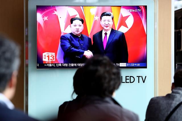 South Koreans watch a televised meeting of Kim Jong-un and Xi Jinping in March 2018 (Chung Sung-Jun/Getty Images)