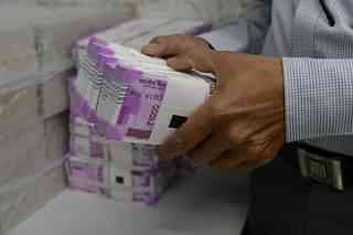 Stacks of new Rs 2,000 notes (SAM PANTHAKY/AFP/GettyImages)