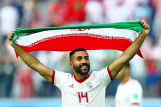 Saman Ghoddos of Iran celebrates the victory over Morocco. (Richard Heathcote/Getty Images)