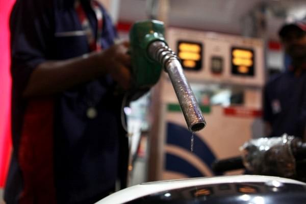 A car owner gets his fuel tank filled with petrol from a petrol pump at Prabhadevi. (Sattish Bate/Hindustan Times via Getty Images)
