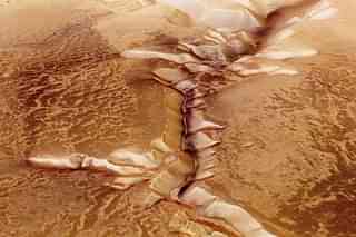 In this handout image supplied by the European Space Agency (ESA), Echus Chasma, one of the largest water source regions on Mars, is pictured from ESA’s Mars Express. The dark material shows a network of light-coloured, incised valleys that look similar to drainage networks known on Earth. (ESA via GettyImages)
