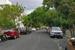 Cars parked on a road in Bengaluru. 