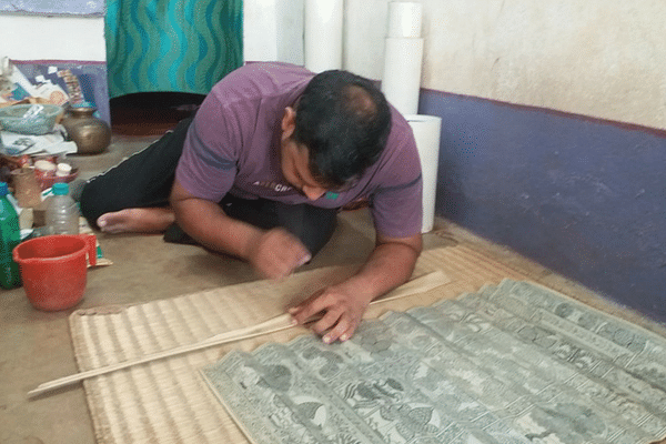 Sridhar Nayak works on a Pattachitra