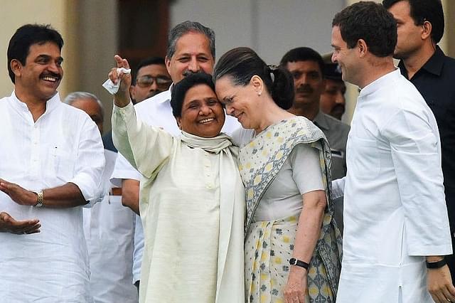 All smiles but no understanding? Mayawati (L) with Sonia and Rahul Gandhi. (Arijit Sen/Hindustan Times via Getty Images)