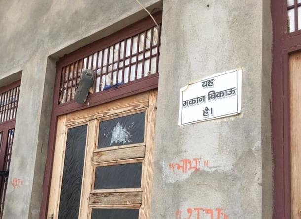 One of the houses with the ‘house on sale’ poster