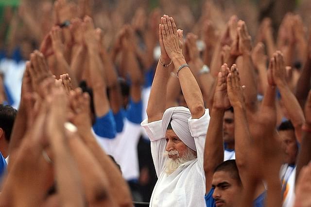 Yoga is for overall welfare of body and mind (Photo: PRAKASH SINGH/AFP/Getty Images)
