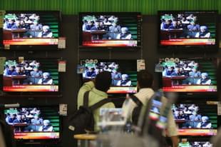 Annual Budget 2011-12 is seen on a TV Screen at the shop at Prabhadevi on Monday.(Kunal Patil/Hindustan Times via Getty Images)