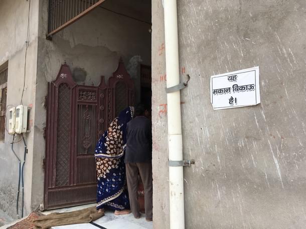 One of the houses with the ‘house on sale’ poster