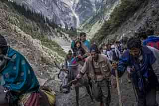 Hindu pilgrims with the assistance of Kashmiri guides, make their pilgrimage to the sacred Amarnath Cave. (Daniel Berehulak/GettyImages)